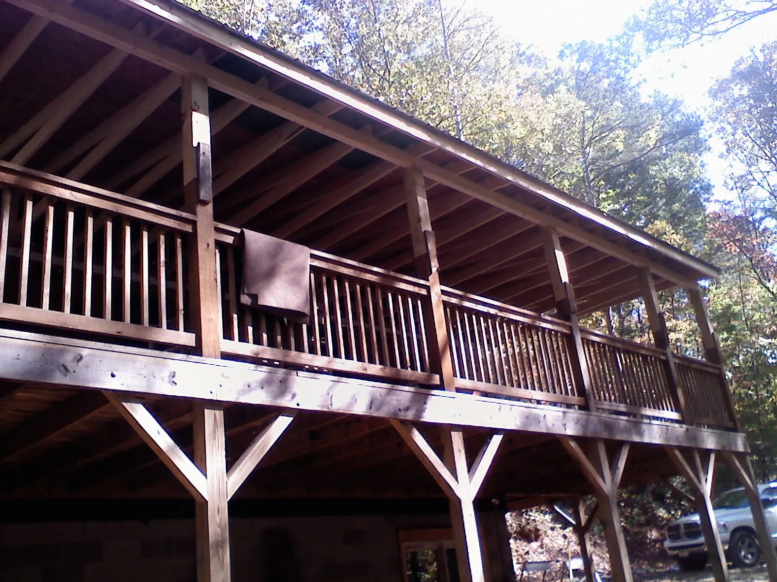 Timber framing under a new elevated porch and deck — Roof Leak Repair in Plainview by Roofing Brothers
